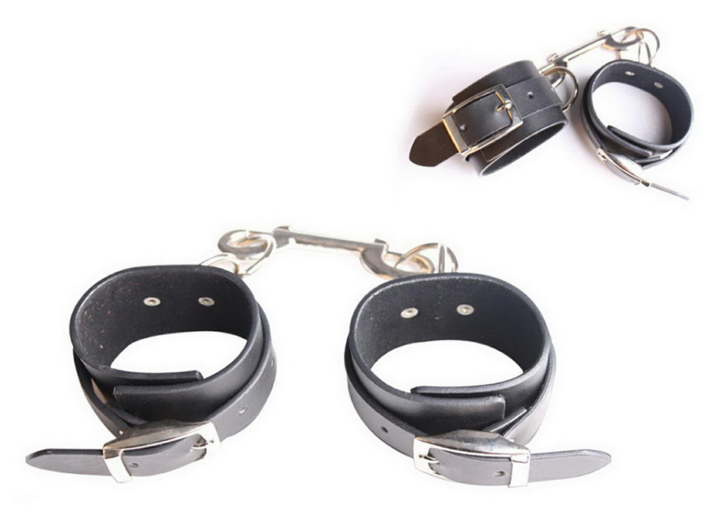 Leather Handcuffs. Adjustable Straps With Metal Fittings.